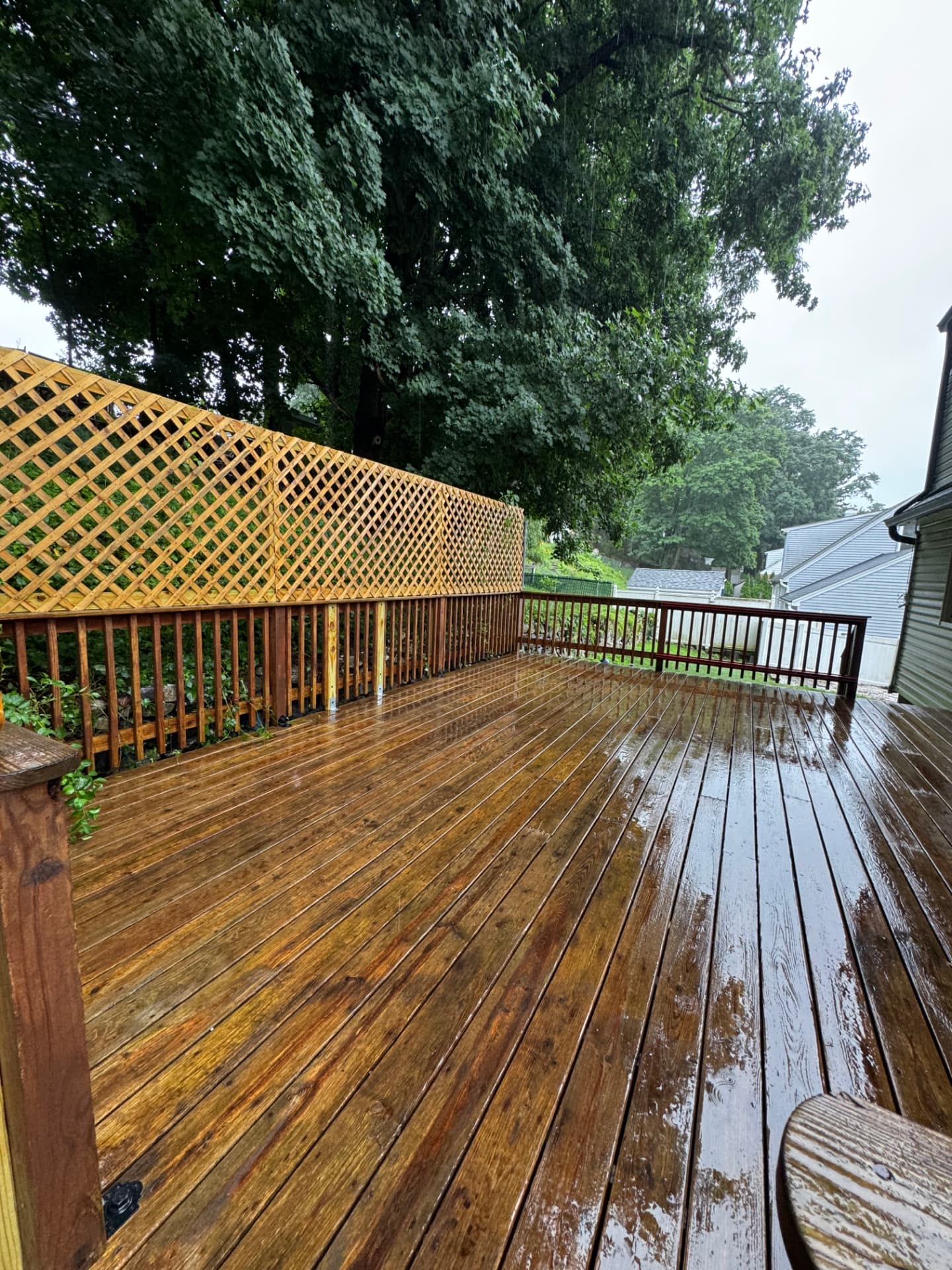 Freshly power washed wood deck with restored color and clean boards